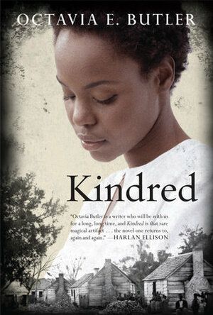The image shows the cover of Kindred by Octavia E. Butler, the top of the cover has a Black lady wearing a white gown, she is looking down. Beneath her are a row of houses with Black men and women outside of them. 