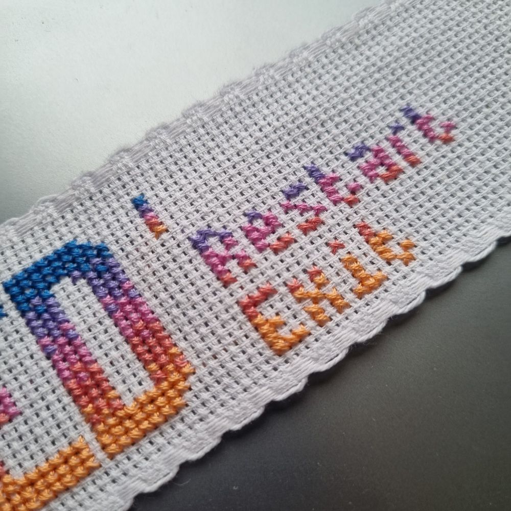 Close up of a cross stitched bookmark