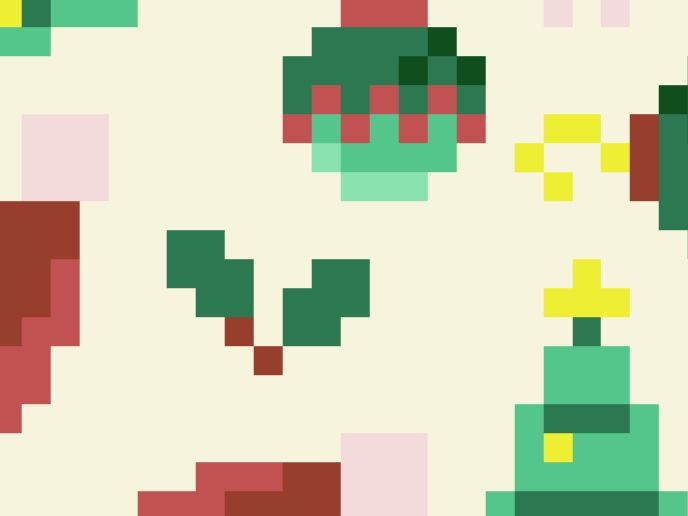 Close up of pixel art including holly, a bauble, and parts of a Santa hat and Christmas tree