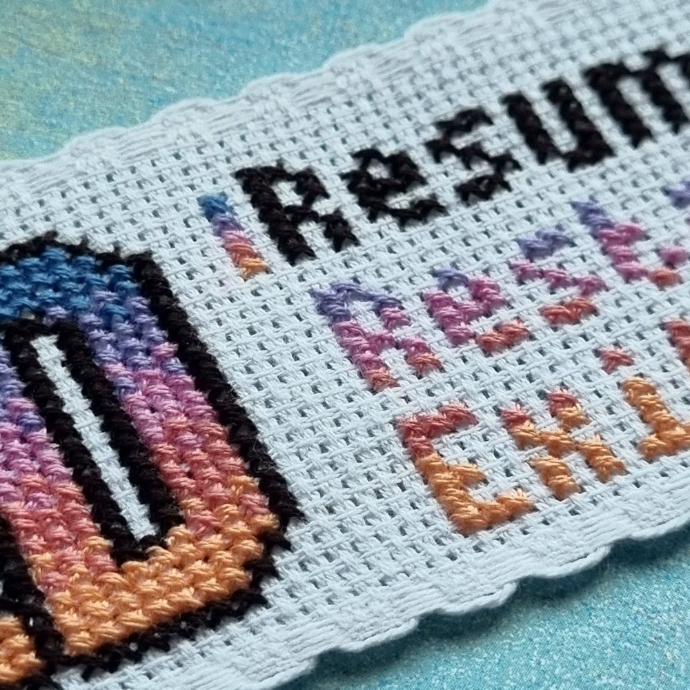 Close up of a cross stitched bookmark