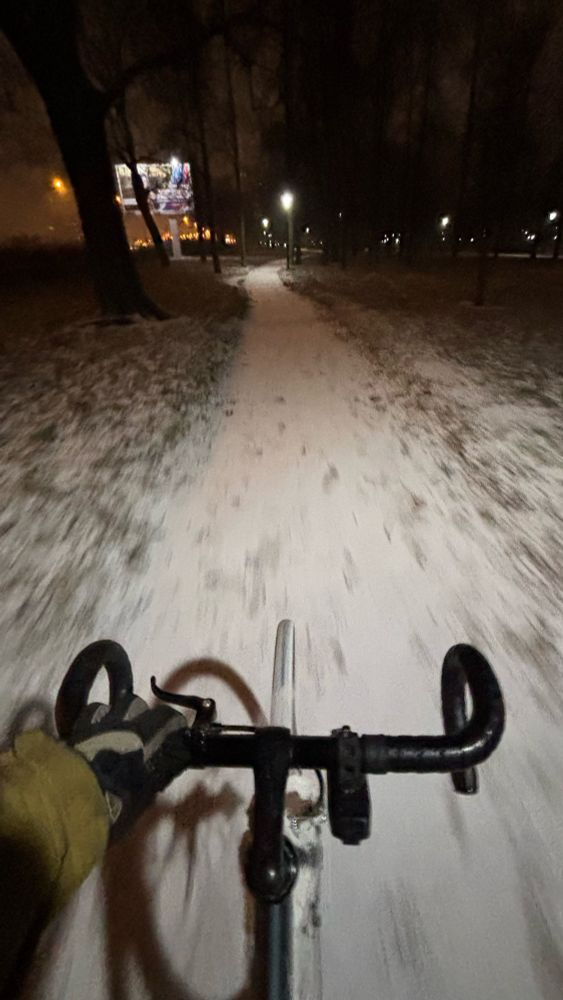 Cycling through a snowy park