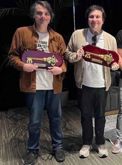 Gerard Way and Frank Iero holding their keys to Belleville NJ, 2025