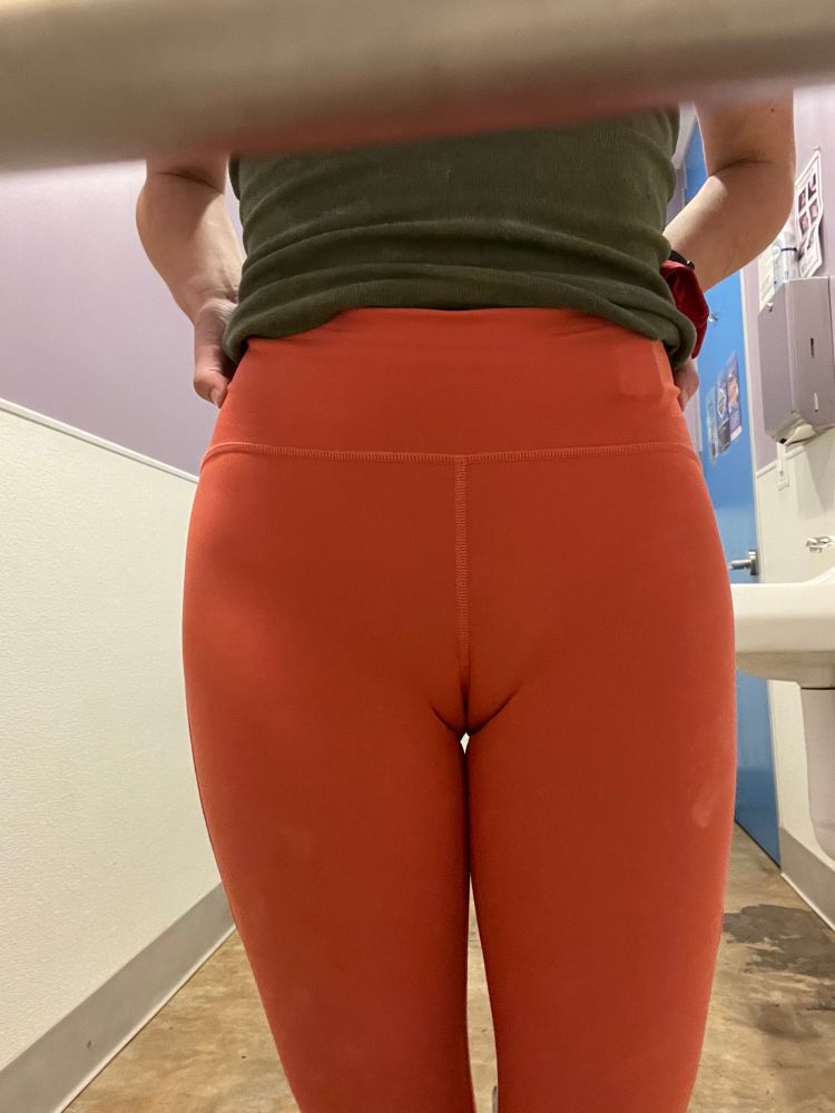 I’m wearing coral leggings and a green tank top and you can see my cameltoe VERY clearly