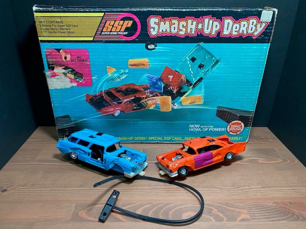 Smash up derby toy cars with box. 