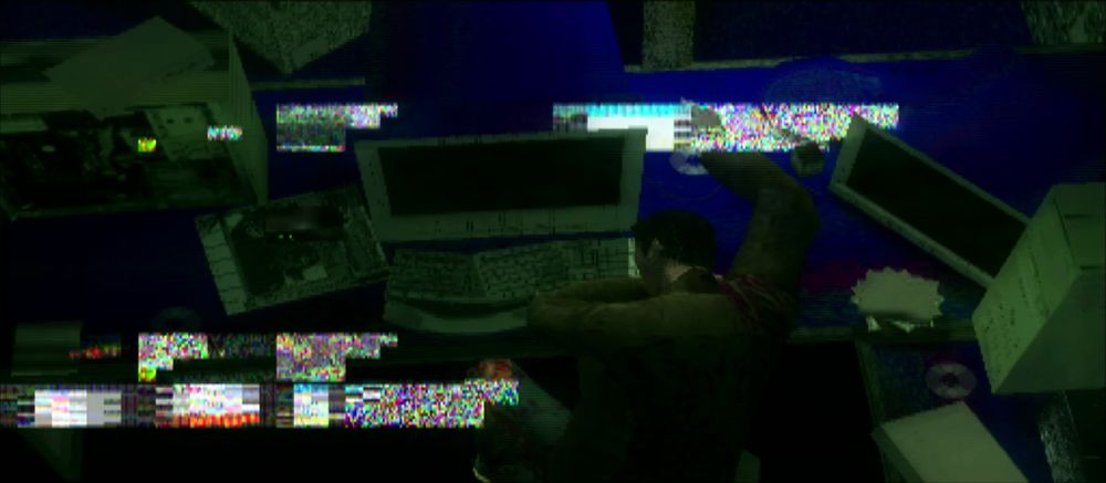 a 3D neo from the matrix asleep at his desk except all the polygons are glitchy and there's some pixels stuck to the screen