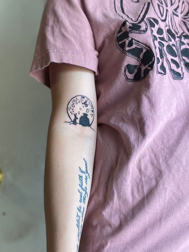 Tattoo of Shrek and donkey sitting on a cliff looking at the moon. 