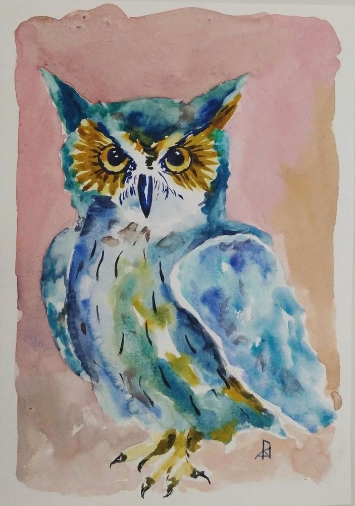 Water color painting of an owl. It looks straight at you. The owl is mostly blue. The background is of a muted pink without any objects in it.