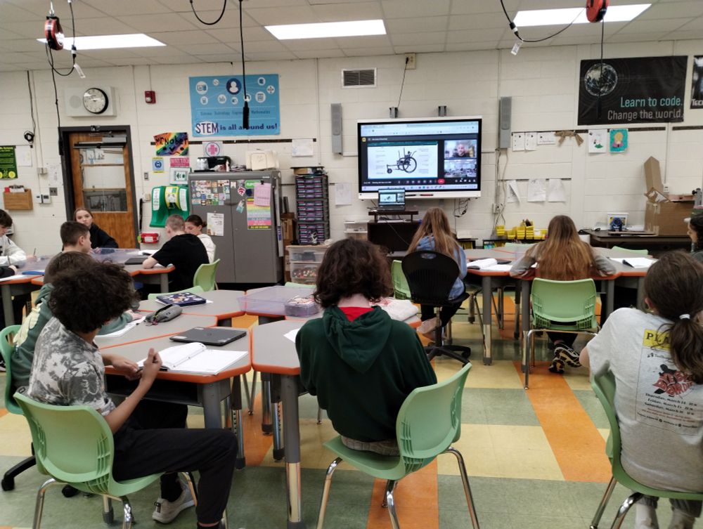 Students sitting listening to a Google Meet with Alex from Grit Freedom Chair