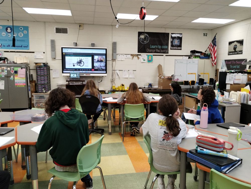 Students sitting listening to a Google Meet with Alex from Grit Freedom Chair