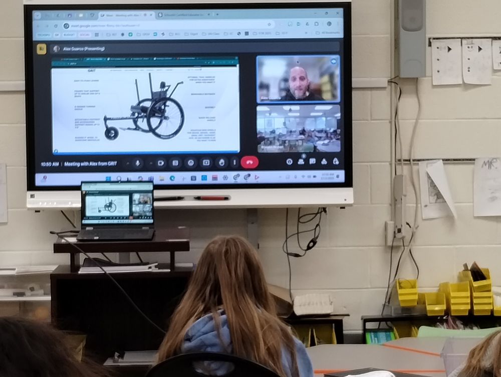 Students sitting listening to a Google Meet with Alex from Grit Freedom Chair.