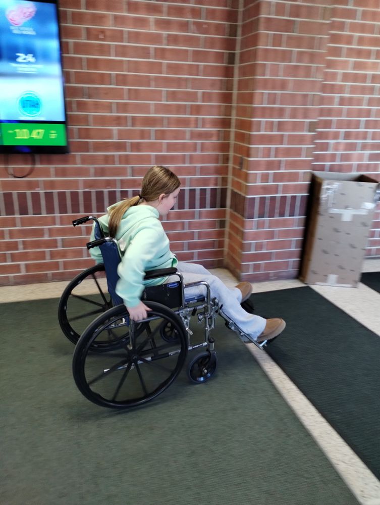 Student navigating the main foyer of a middle school.