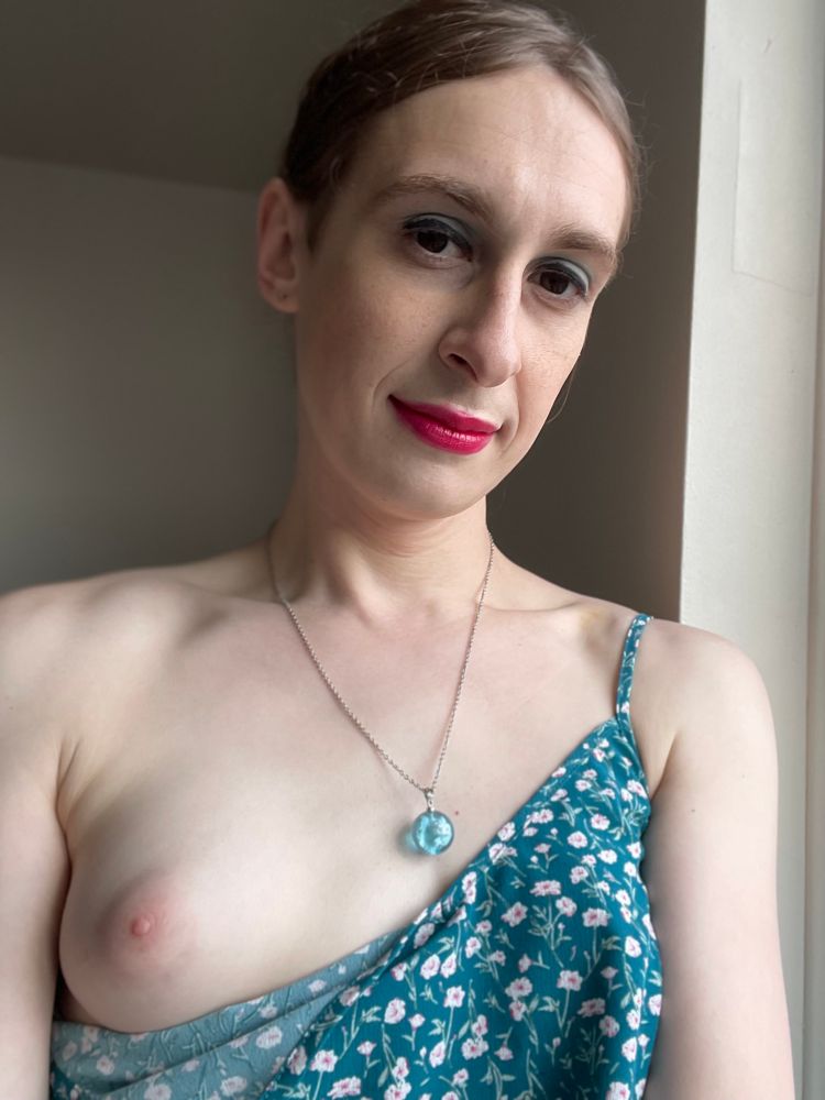 Another shot of Luna. This time part of her dress is let down to expose her perky right breast.