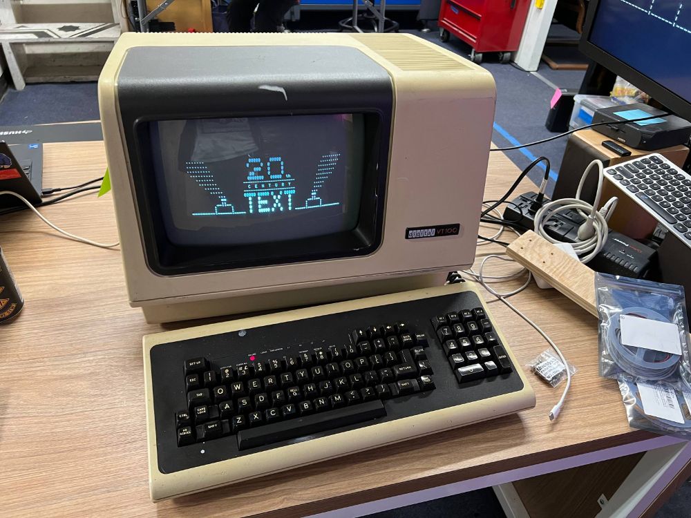 VT100 displays "20th CENTURY TEXT" ASCII art