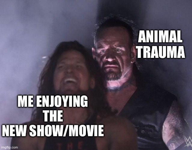 Wrestlers meme where scary one behind happy one. Scary one text reads “animal trauma”