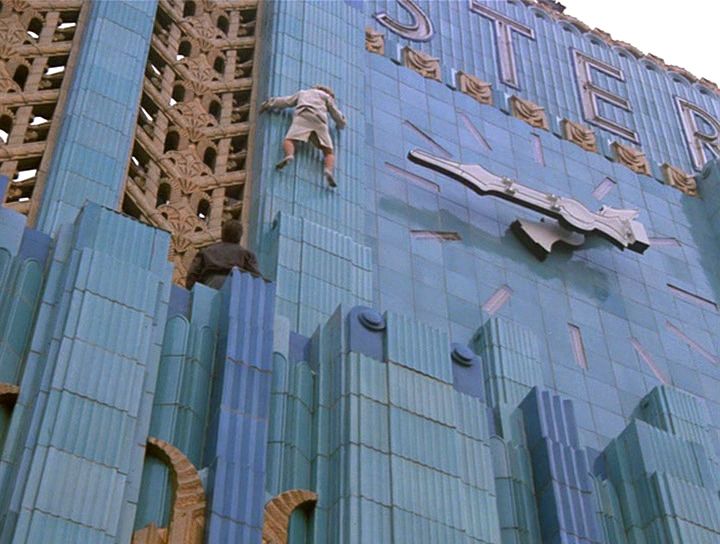 Cybill climbs the clock on the Eastern Columbia Building in the Moonlighting pilot climax.