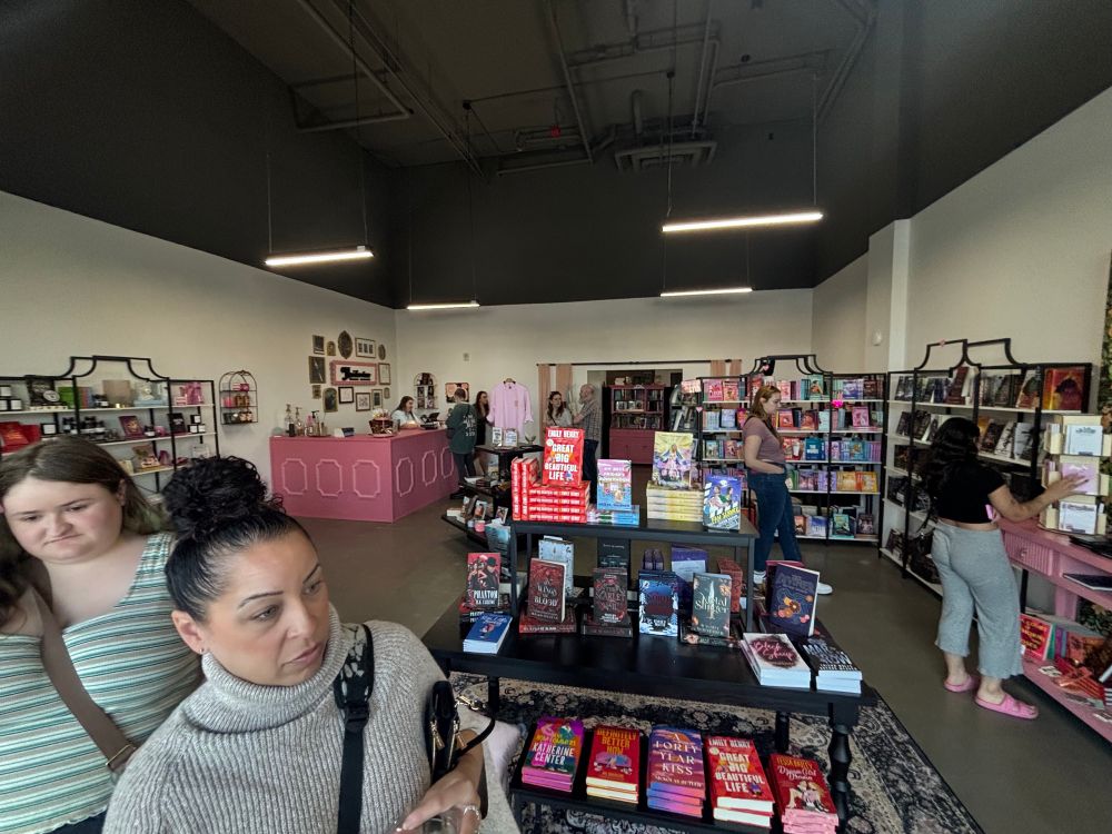 The inside of the store plus shoppers