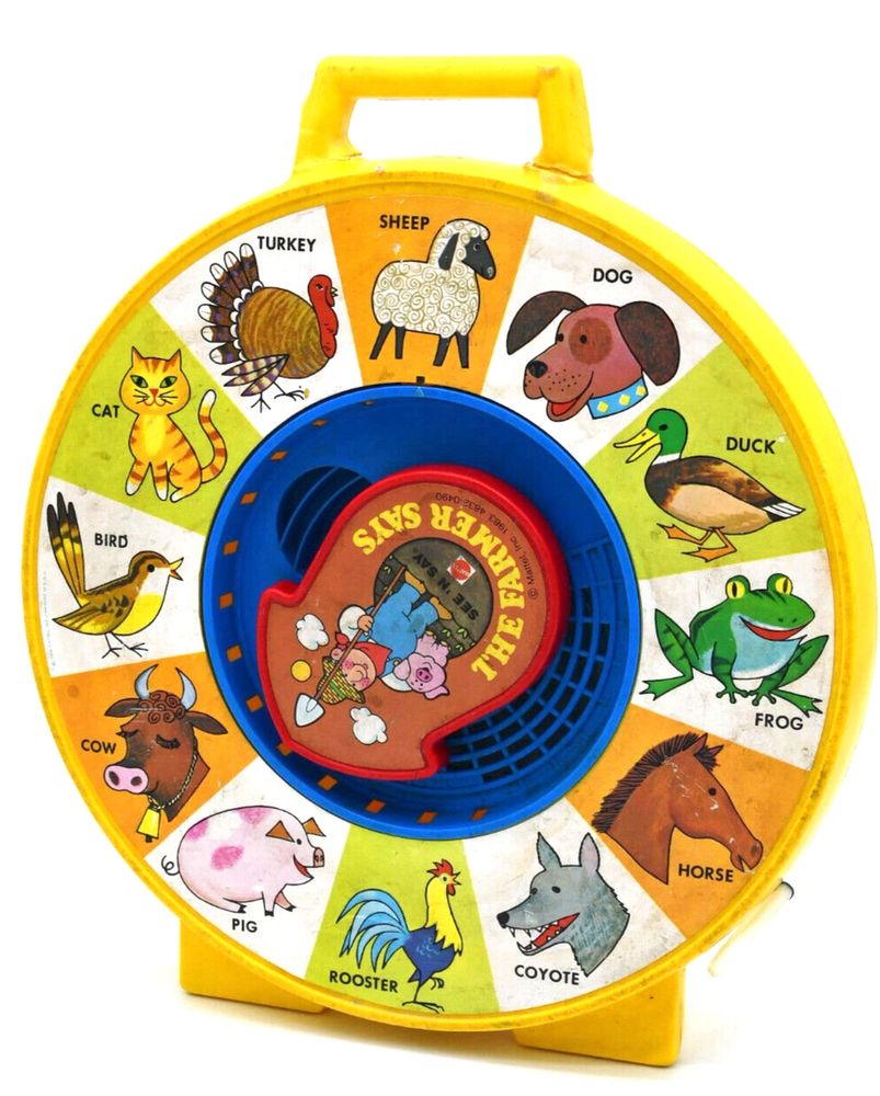 "The Farmer Says" game, where you pull a string and a wheel spins around a clock, with different animals at each place for a number. When the pointer on the wheel stops at an animal, the game makes that animals sound.