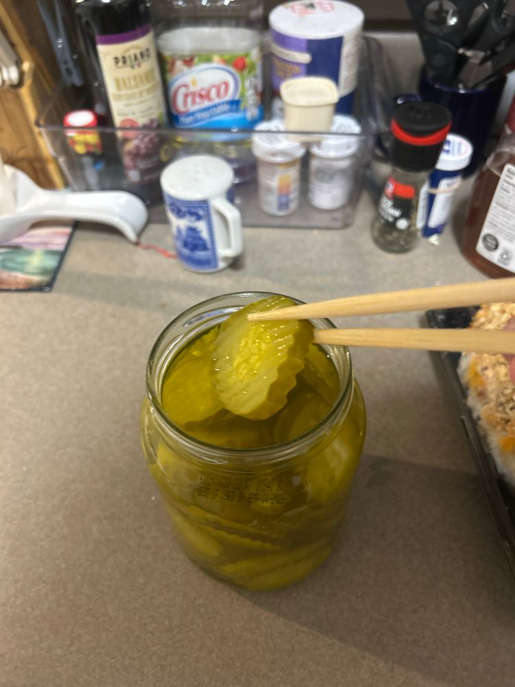 eating pickles out of a jar w/ chopsticks
