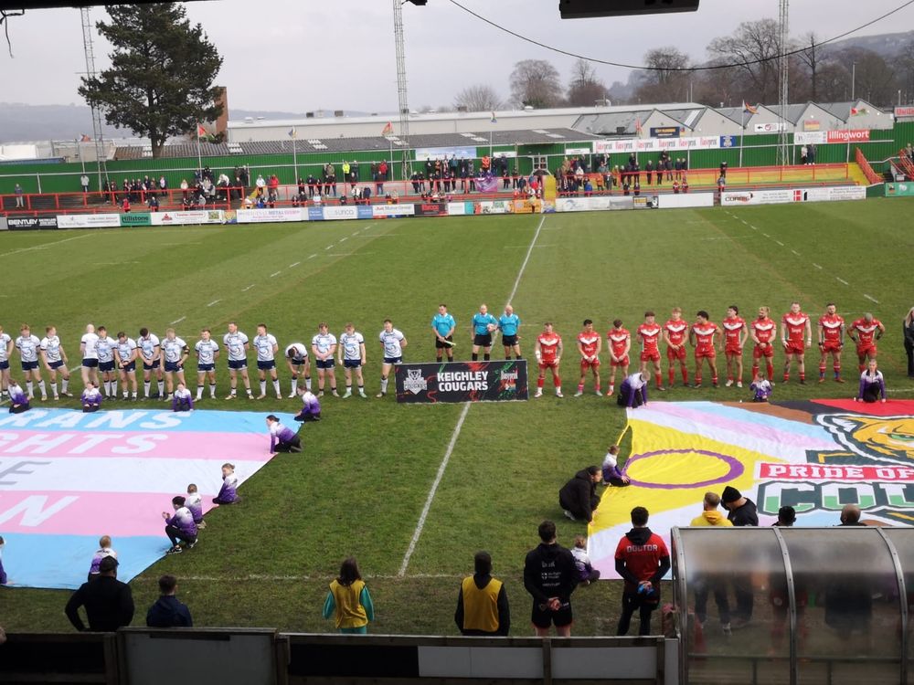 Progress Pride and trans flags being laid out on the pitch before Keighley Cougars' home match against Midlands Hurricanes.
