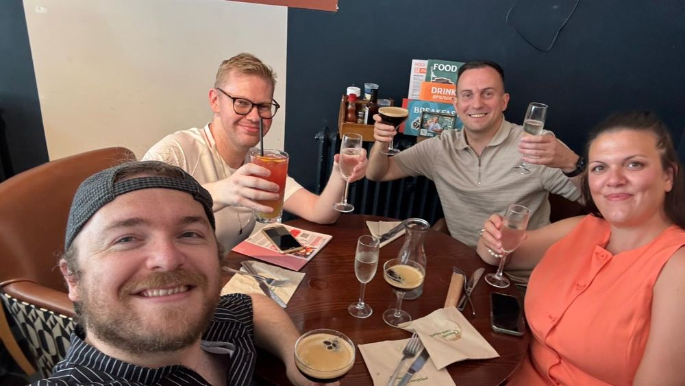 A photo of me having a bottomless brunch while holding drinks with three friends at The Cavendish.