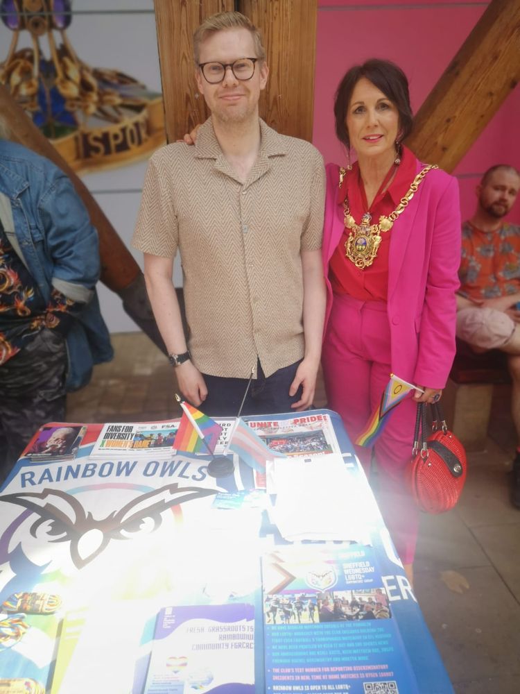 A photo of me with Lord Mayor of Sheffield, Jayne Dunn, at Rainbow Owls' stall for SAYiT's IDAHOBIT event.