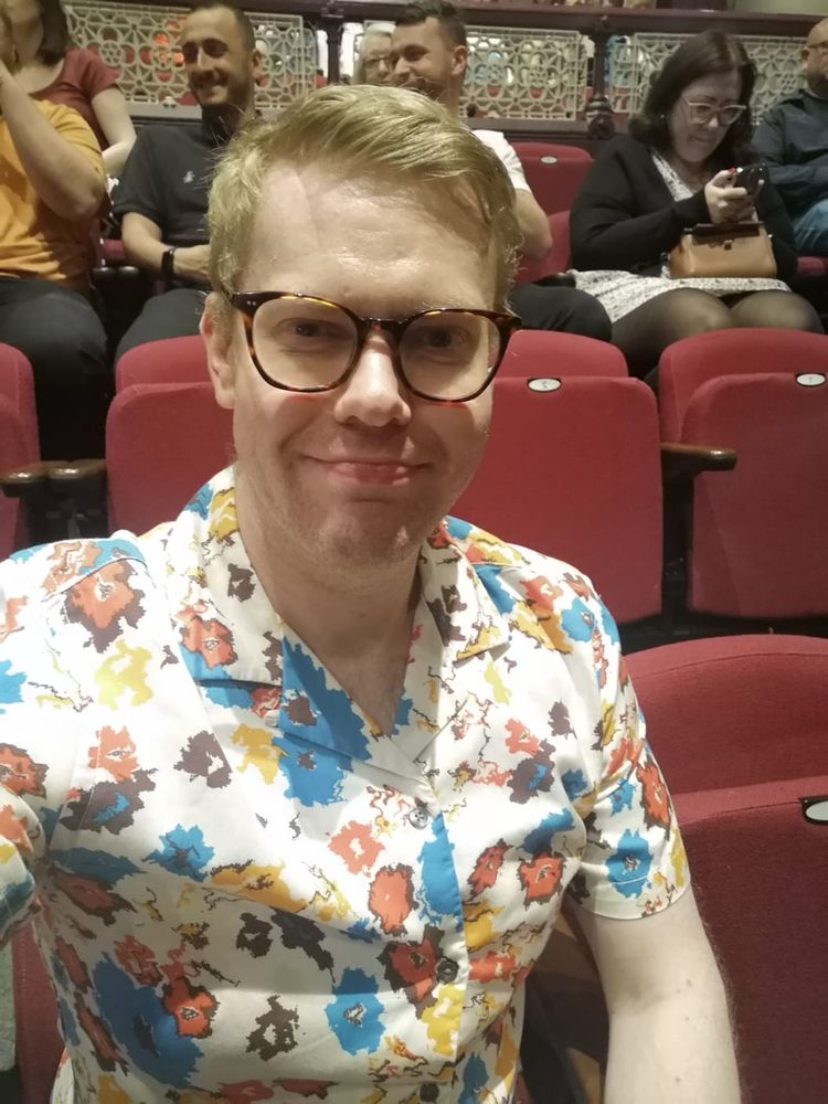 A selfie of me sat in a theatre seat at the University of Sheffield's Drama Studio.