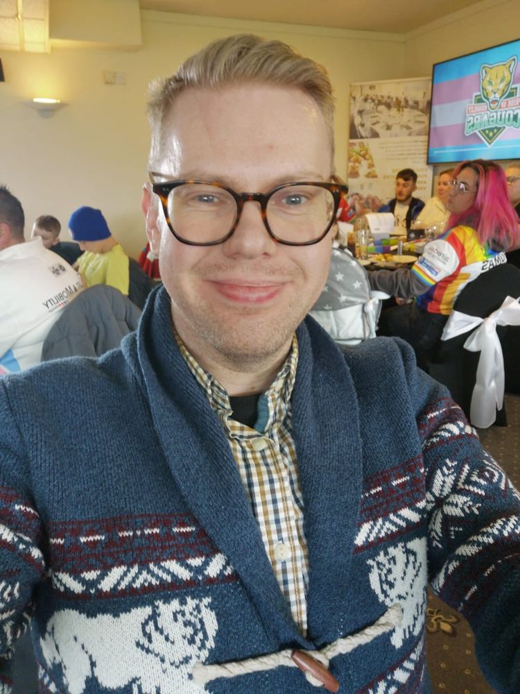 A selfie of me wearing a cardigan and shirt in Keighley Cougars' hospitality suite.