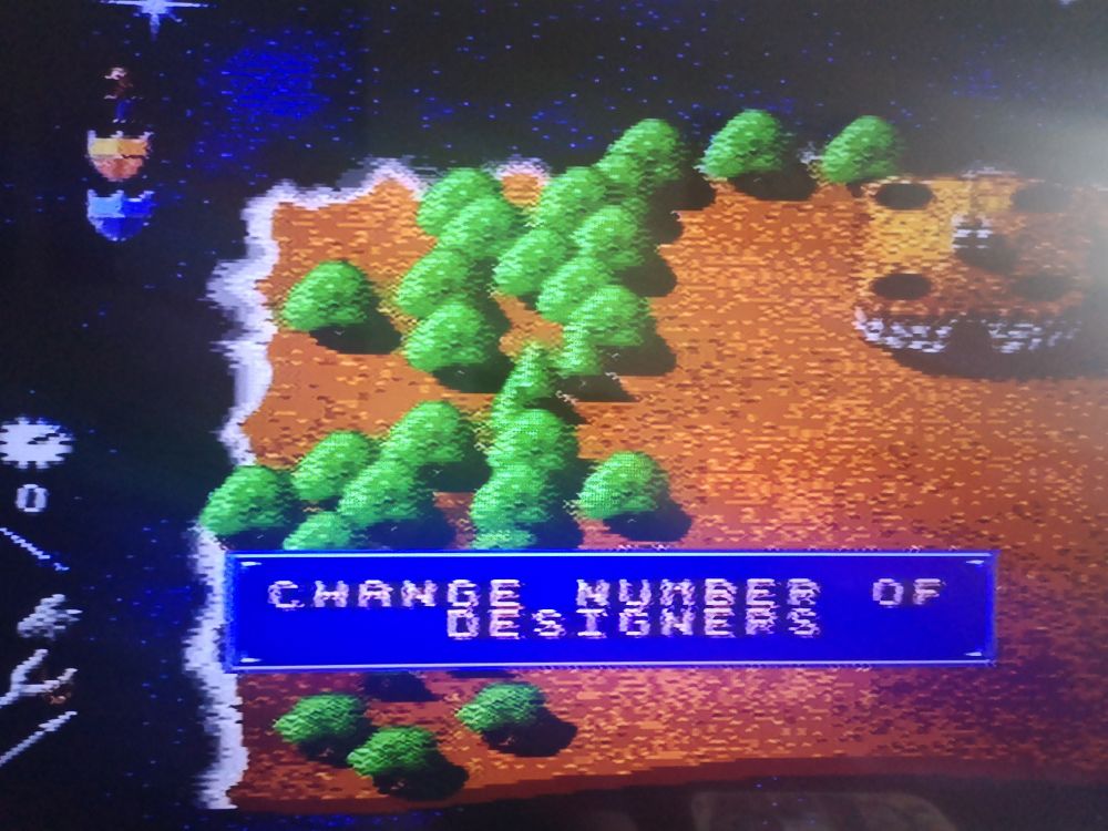 Screenshot from Mega-lo-mania that states "change number of designers".