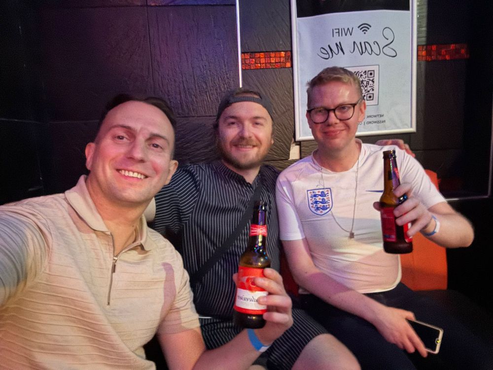 A photo of me having a Budweiser with two friends at Dempsey's.