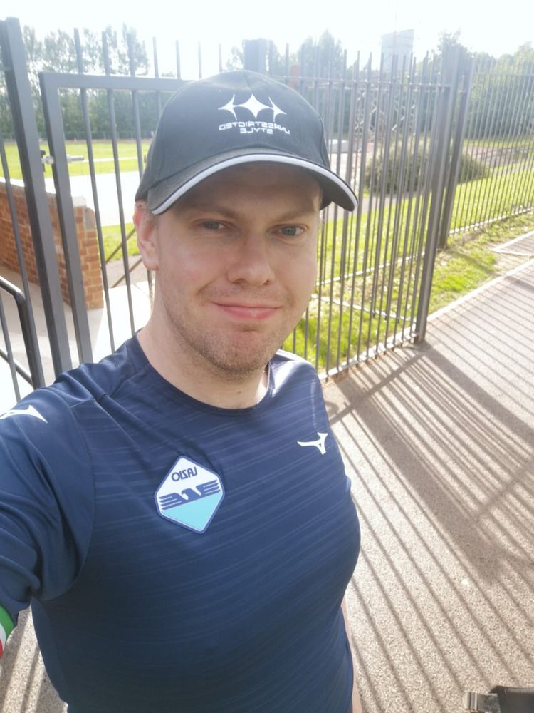  selfie of me wearing a black baseball cap and blue Lazio shirt before a Rainbow Blades LGBTQ+ football session.