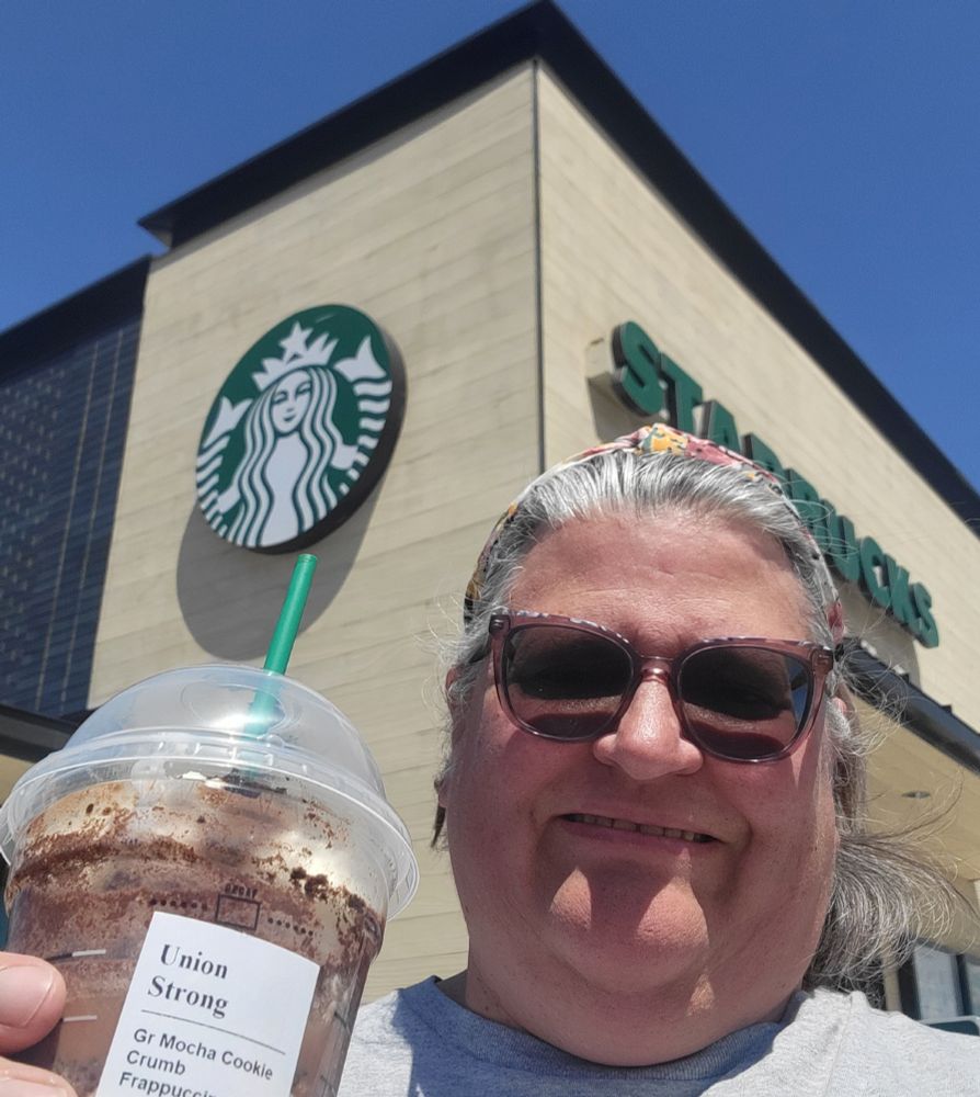 Photo of a starbucks drink for Union Strong in front of the Starbucks logo