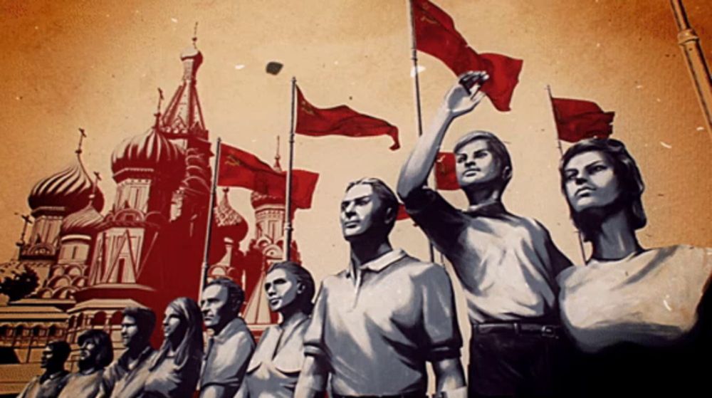 a group of people holding red flags in front of a building that says ' a ' on it