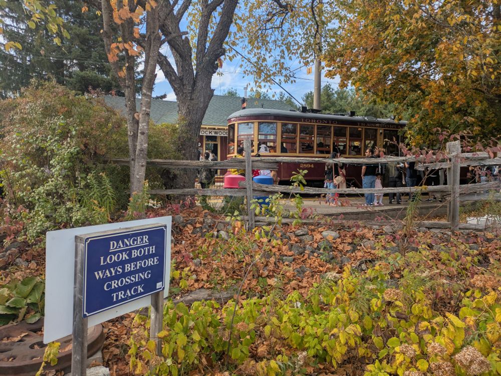 A Peter Witt streetcar at the Halton County Radial Railway Museum; sign says "DANGER LOOK BOTH WAYS BEFORE CROSSING TRACK"