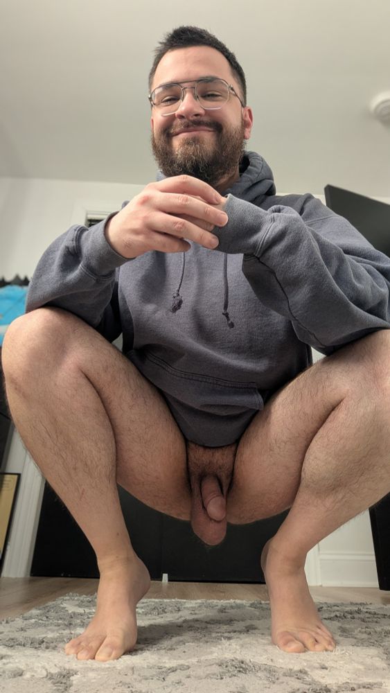 Hermit kneels down, wearing only a hoodie. His balls are dangling and his cock is semi-flaccid
