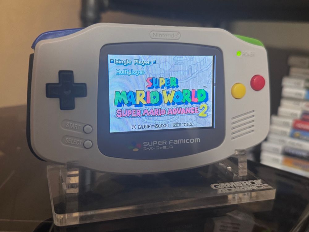 Super Famicom themed Game Boy Advance showing the Super Mario World: Super Mario Advance 2 title screen