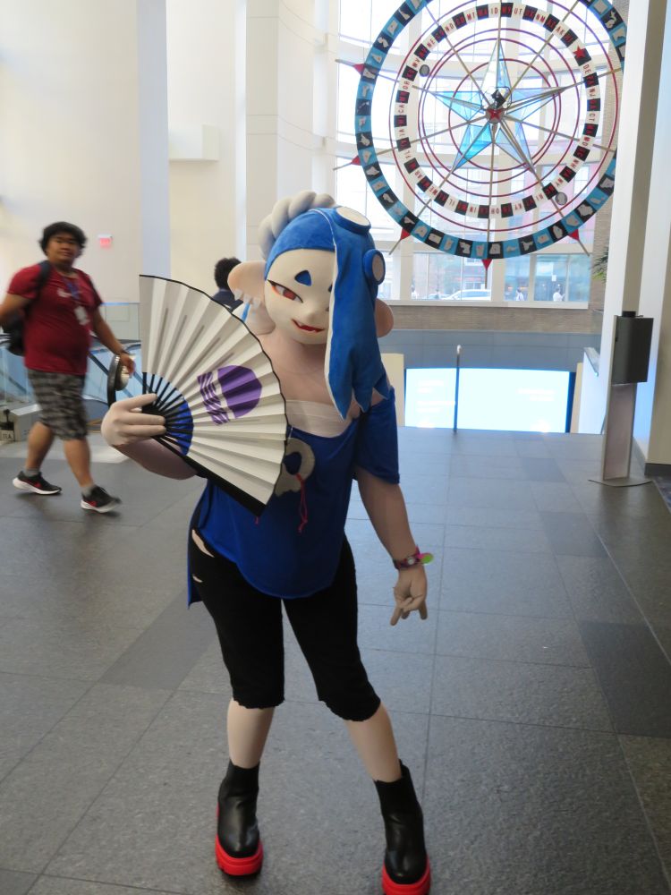 A Shiver cosplayer wearing a full mask of the character