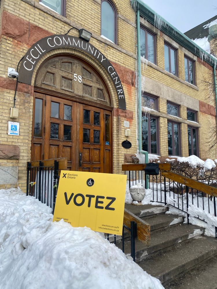 Elections Ontario vote sign in a snowbank at Cecil Community Centre