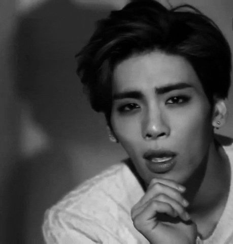 The late Kim Jonghyun of the k-pop band SHINee with his hand on his chin being handsome as usual. 