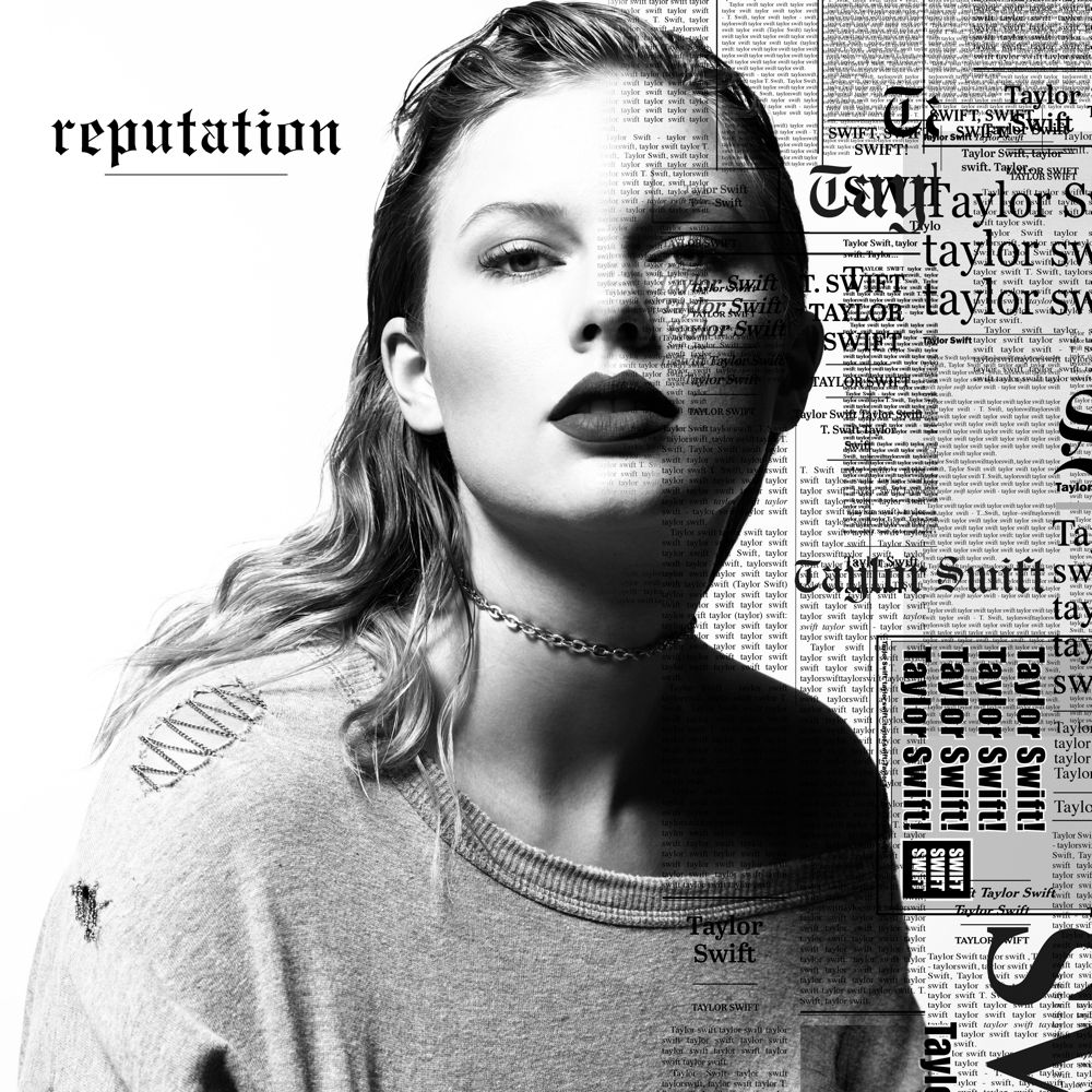 Taylor swift reputation album cover.

Taylor swifts blonde hair is slicked back and she’s wearing a chain choker and a ripped off the shoulder sweater. There’s newspaper print behind her saying Taylor swift all over. On the top left corner it says reputation and it’s all in black and white 