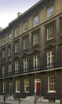 Exterior of 24 Gordon Square, entrance to UCL History Dept. Late Georgian Building with red door.