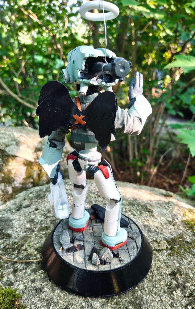 A ten-inch figure of the robot Canti, from FLCL. He is teal and humanoid with a TV for a head. 