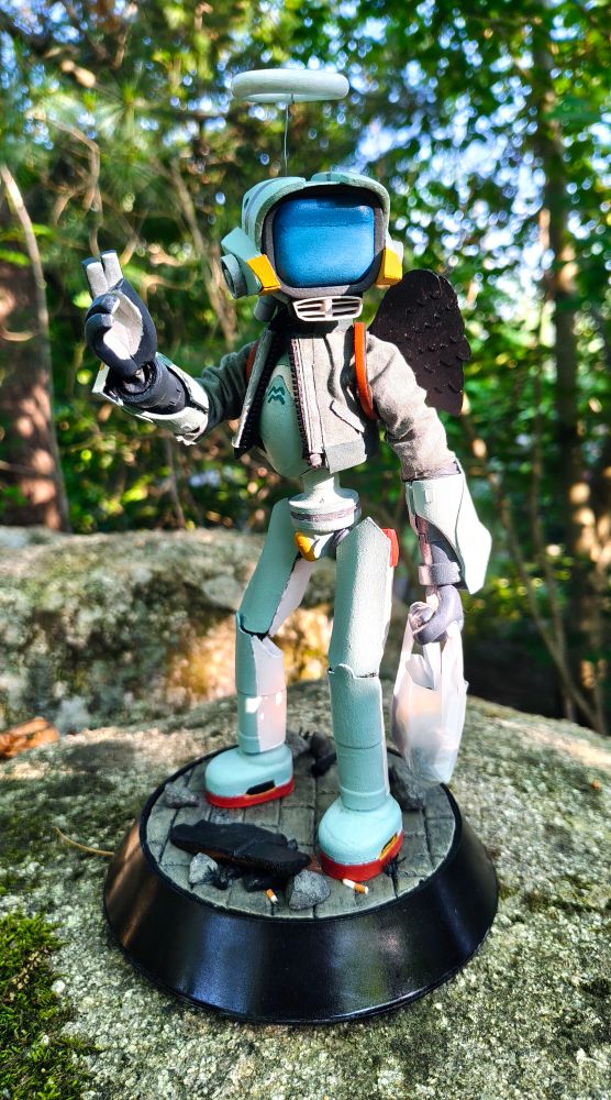 A ten-inch figure of the robot Canti, from FLCL. He is teal and humanoid with a TV for a head. 