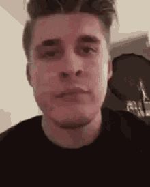 YouTuber Ludwig blankly eating food while staring at the camera