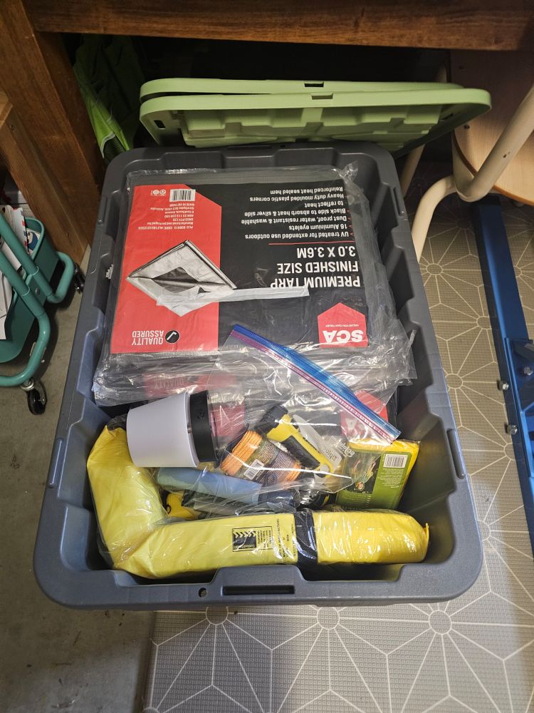 Storage box holding tarps, torches, lifevests etc.