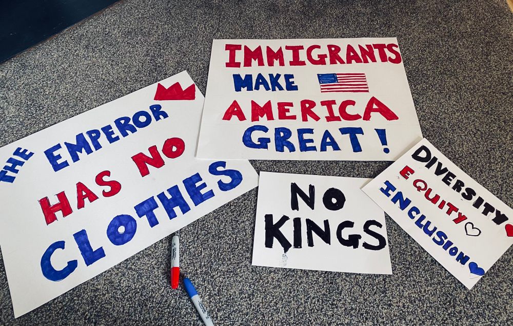 Signs: The Emperor Has No Clothes, Immigrants Make America Great, No Kings, Diversity Equity Inclusion 