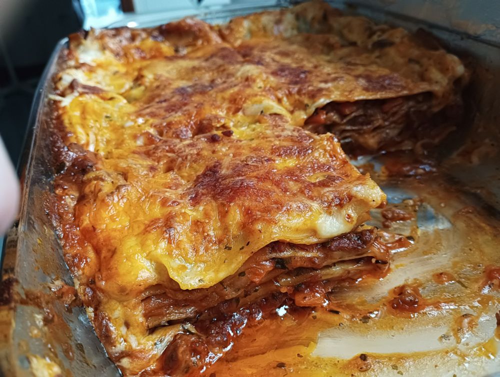 A photo of lasagne Bolognese recently cooked. Several portions are missing, for some reason :)