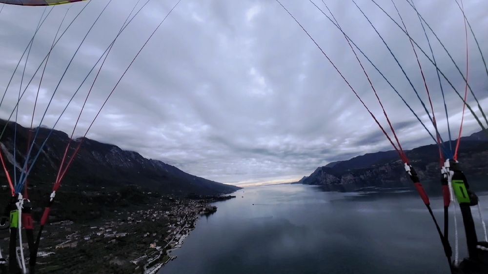 View to the south from above Lake Garda.
Paraglider lines frame the shot.