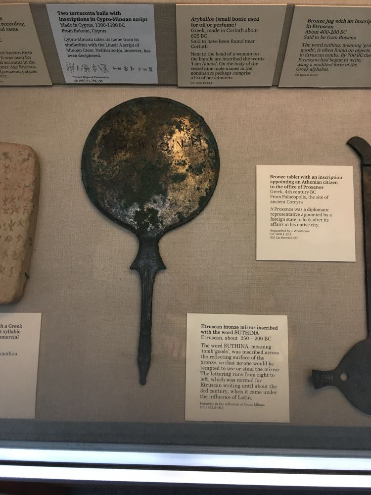 Etruscan bronze mirror in a display case at the British museum