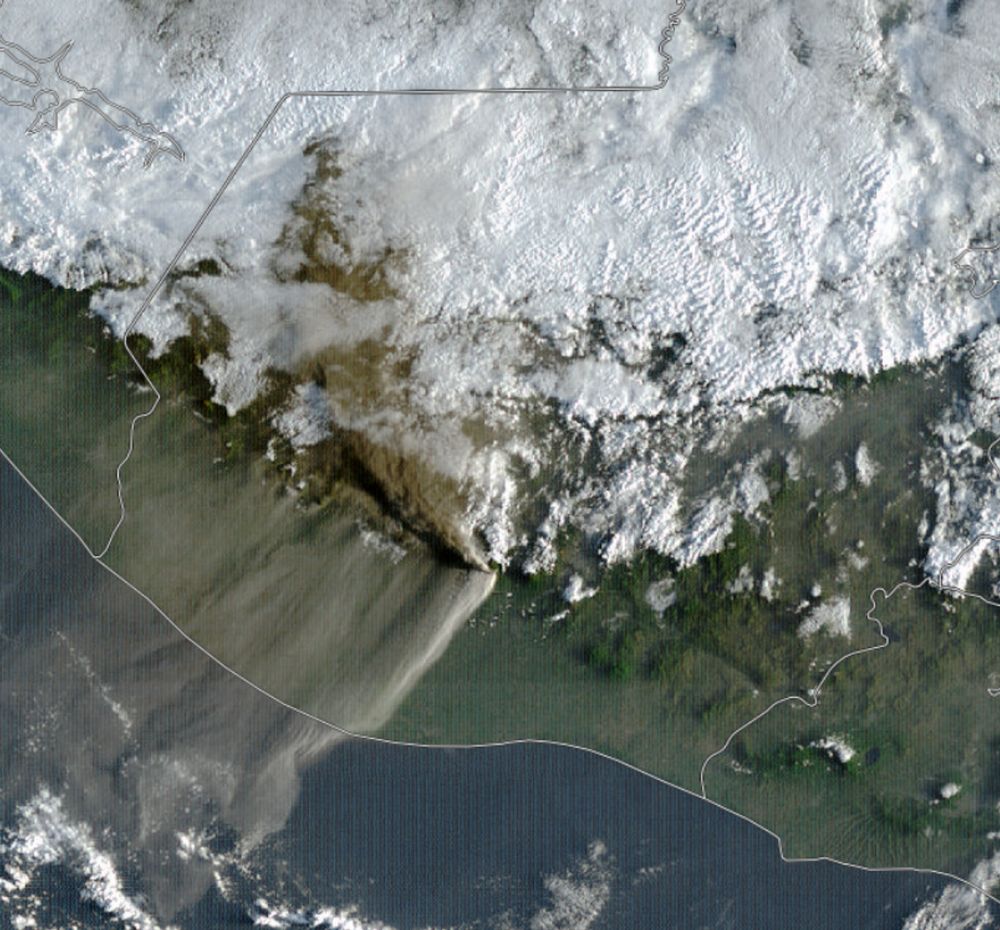 A satellite image of Guatemala showing a brown ash plume going northwest from near the centre of the image. Thin dust is visible on the SW side of the plume. Low clouds in the northern half of the image.