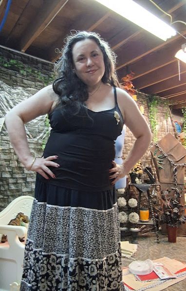 Me in a black tank and black floral skirt because it's too dang hot but the vintage gold bangle and pearl flower brooch are nice. Goth girl in August! 